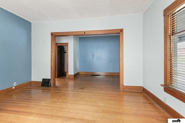 3218 Holdrege St, Lincoln, NE 68503 - unfurnished room with light wood finished floors, ornamental molding, and baseboards