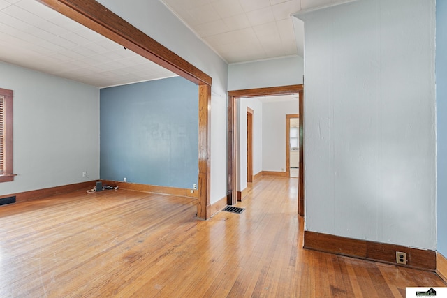 3218 Holdrege St, Lincoln, NE 68503 - spare room featuring hardwood / wood-style floors and baseboards