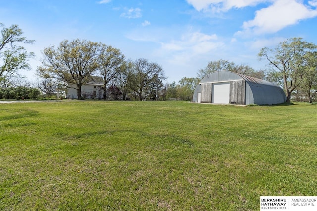 6301 SW 34th Ct, Lincoln, NE 68523 - view of yard with a garage, a pole building, and an outbuilding