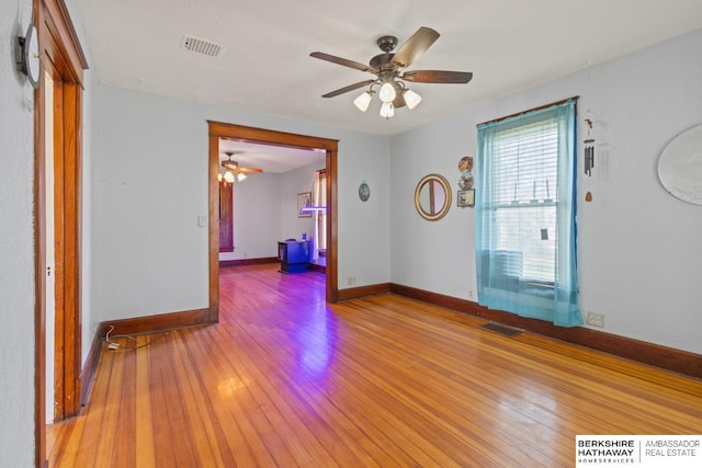 6301 SW 34th Ct, Lincoln, NE 68523 - unfurnished room with baseboards, a ceiling fan, light wood finished floors, and visible vents