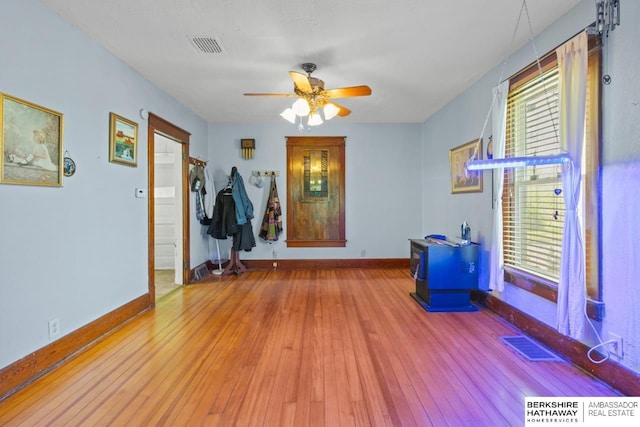 6301 SW 34th Ct, Lincoln, NE 68523 - interior space featuring wood-type flooring, a ceiling fan, baseboards, and visible vents