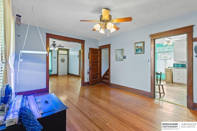 6301 SW 34th Ct, Lincoln, NE 68523 - interior space featuring ceiling fan, baseboards, and light wood-type flooring
