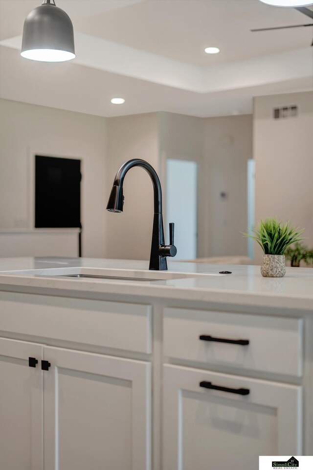 interior details with a sink and recessed lighting
