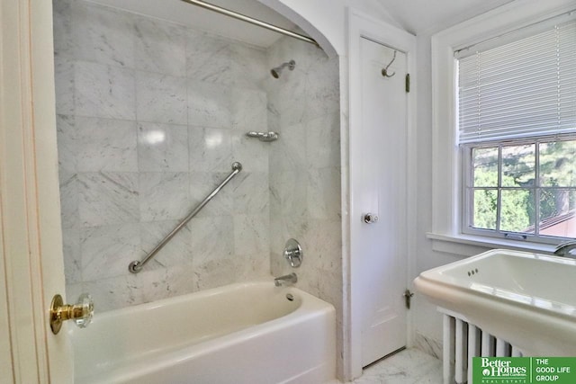 5506 Howard St, Omaha, NE 68106 - bathroom featuring marble finish floors, a sink, and tub / shower combination