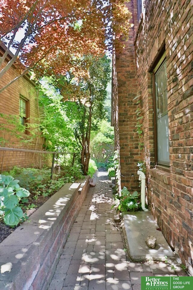 5506 Howard St, Omaha, NE 68106 - view of side of property with brick siding
