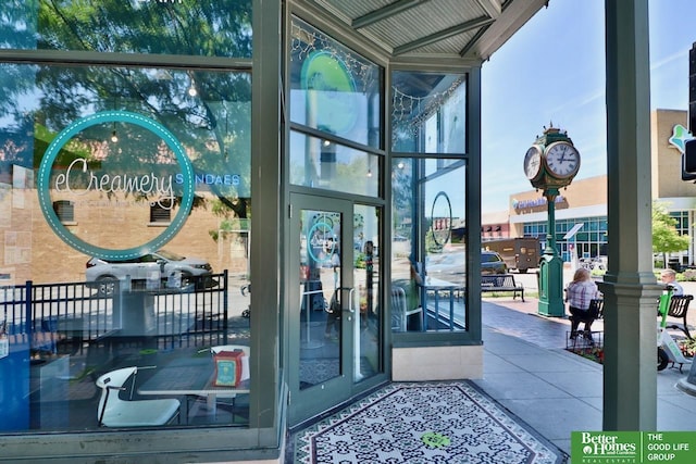 5506 Howard St, Omaha, NE 68106 - doorway to outside featuring floor to ceiling windows