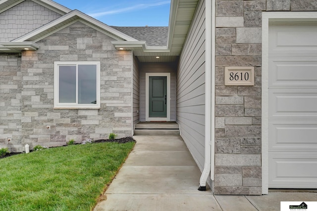 property entrance featuring roof with shingles and stone siding
