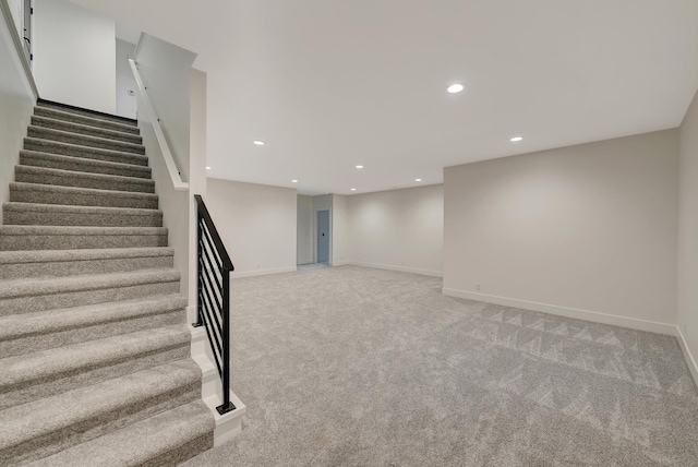 stairway featuring recessed lighting, carpet flooring, and baseboards