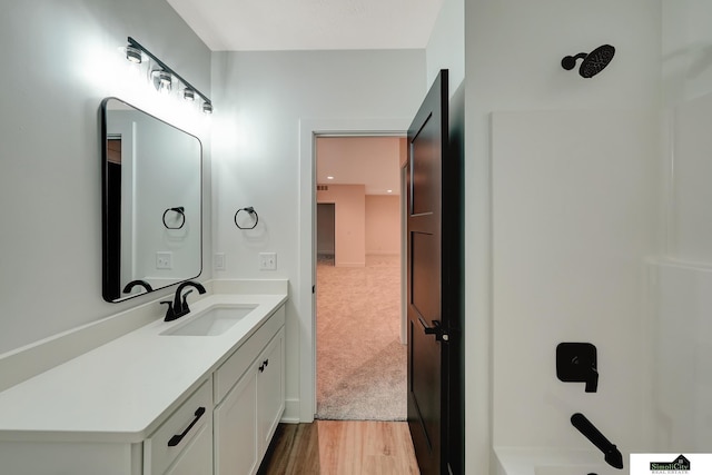 bathroom with vanity and wood finished floors