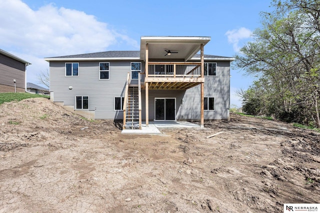rear view of property featuring ceiling fan, a patio area, and a wooden deck