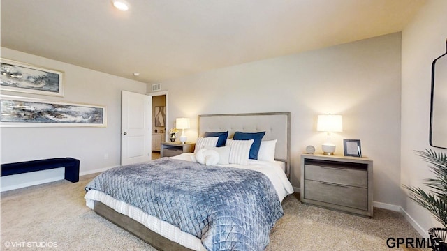 bedroom featuring baseboards, visible vents, and carpet