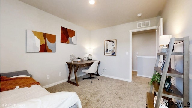carpeted bedroom featuring baseboards and visible vents