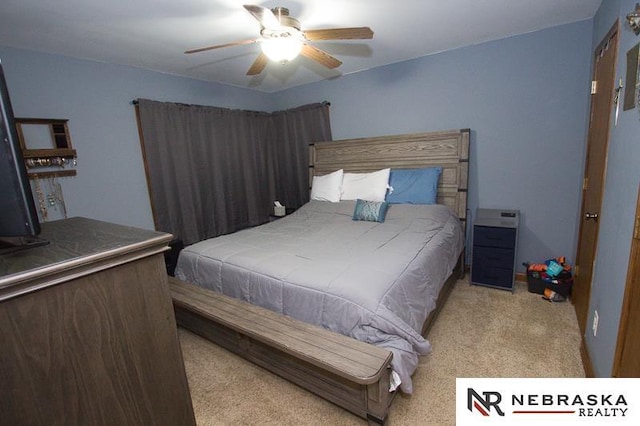 carpeted bedroom featuring a ceiling fan