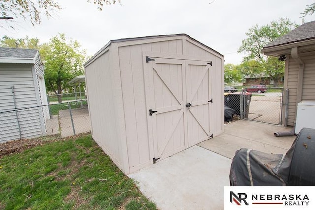 view of shed with fence