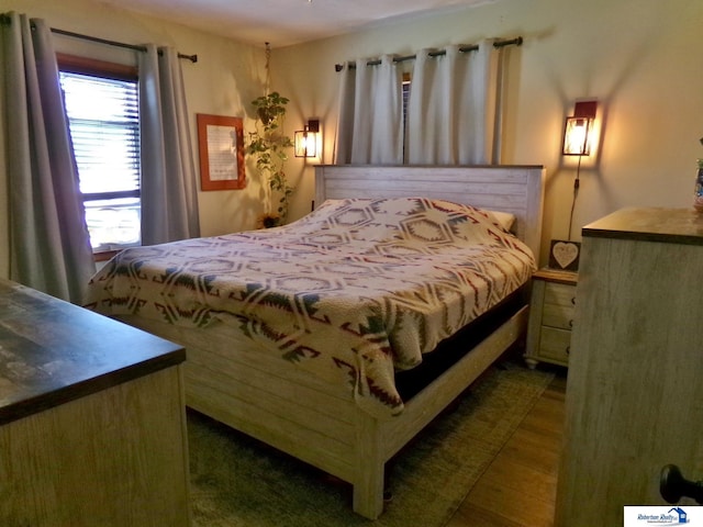 bedroom featuring dark wood-style floors