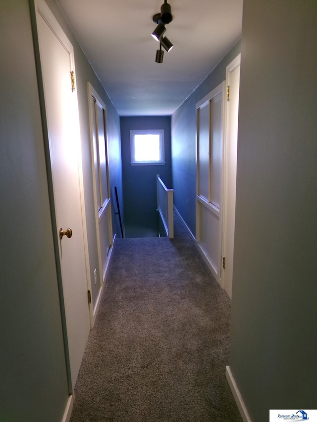 corridor featuring carpet flooring