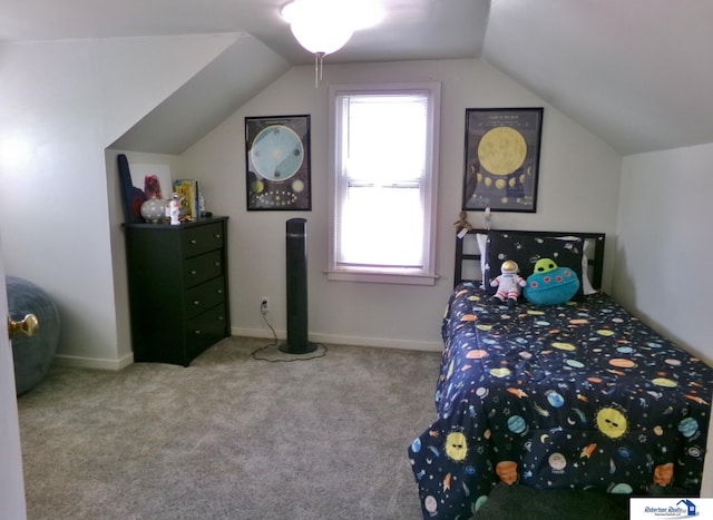 bedroom with vaulted ceiling and carpet flooring