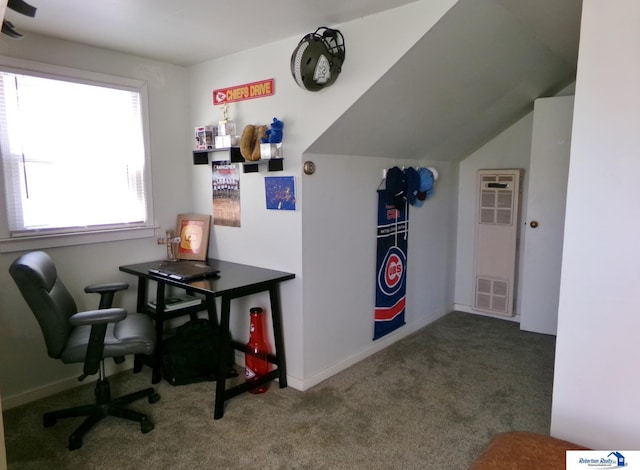office space featuring baseboards, a heating unit, and carpet