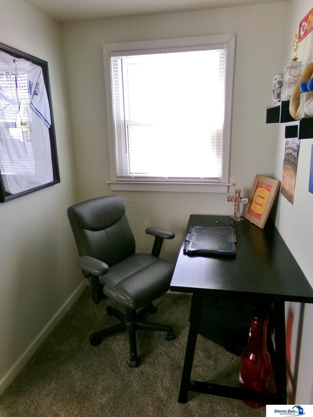 home office with baseboards and carpet flooring