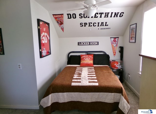 bedroom with carpet flooring, a ceiling fan, baseboards, and vaulted ceiling