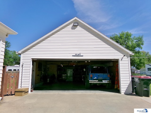 garage with fence