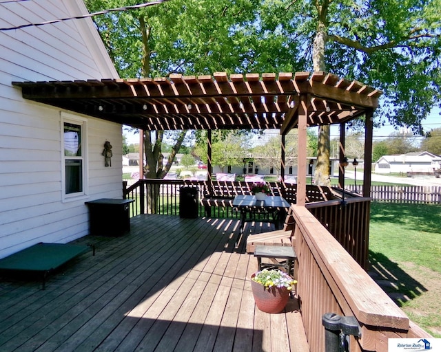 deck featuring fence, a pergola, and a yard
