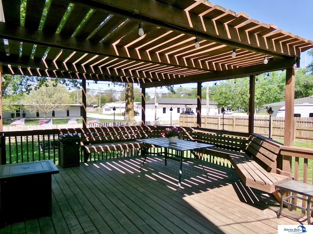 wooden deck with fence and a pergola