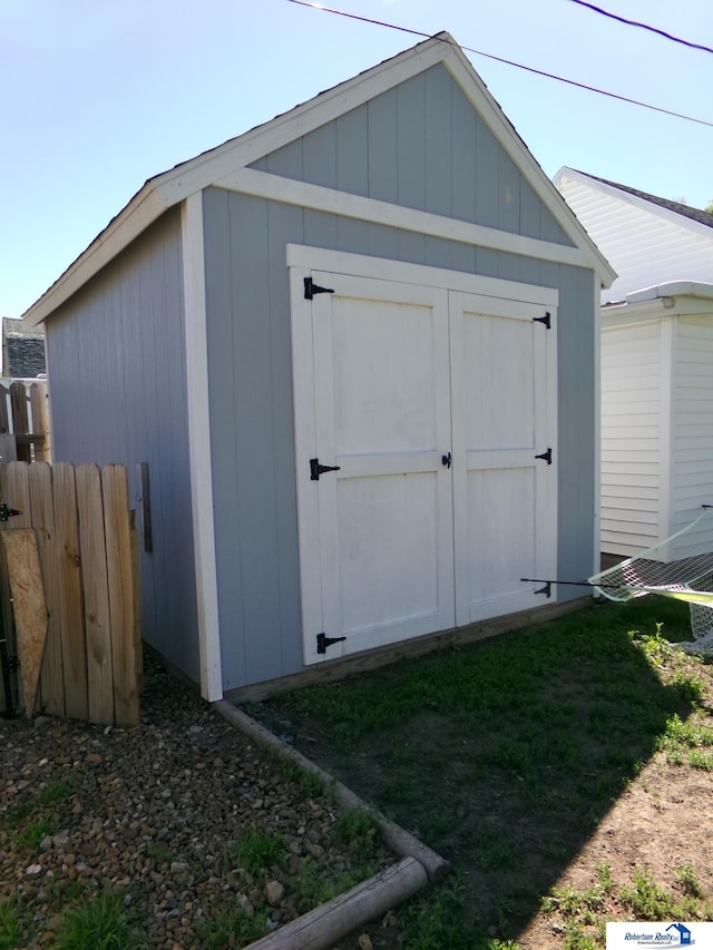 view of shed with fence