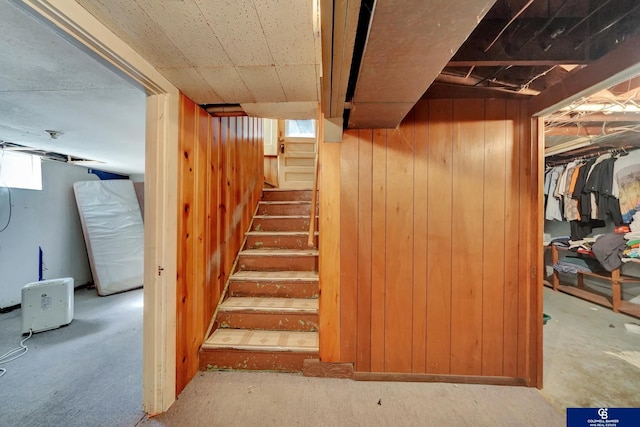 interior space with wooden walls and stairway