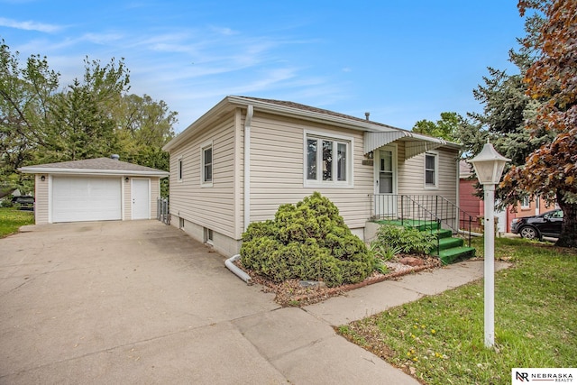 4230 N 11th St, Lincoln, NE 68521 - bungalow-style house with a garage and an outbuilding