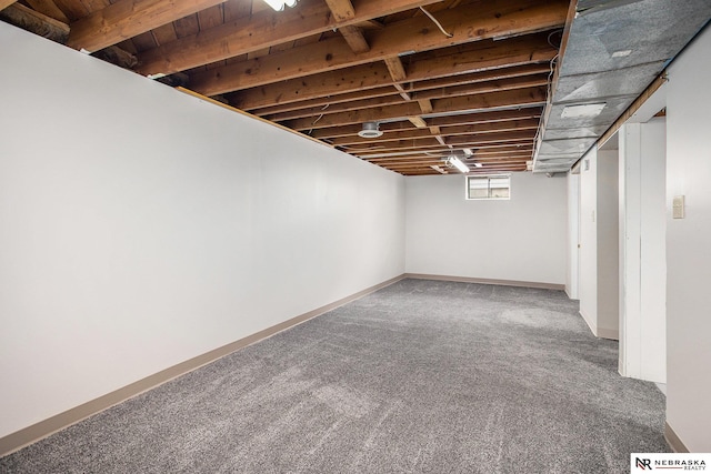 4230 N 11th St, Lincoln, NE 68521 - below grade area with baseboards and carpet