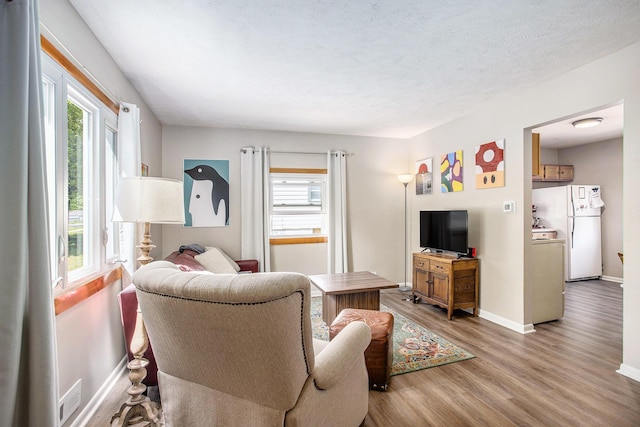 4230 N 11th St, Lincoln, NE 68521 - living area with baseboards, visible vents, light wood-type flooring, and a wealth of natural light
