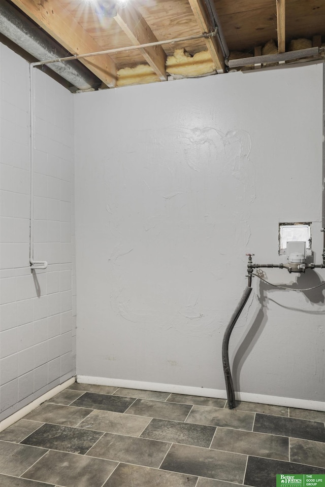 basement featuring baseboards