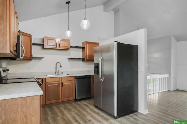 kitchen with a sink, high vaulted ceiling, stainless steel appliances, and light wood-type flooring