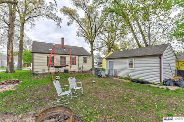 view of yard with fence and a fire pit