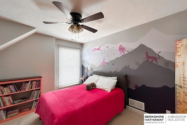 carpeted bedroom featuring ceiling fan, visible vents, and vaulted ceiling