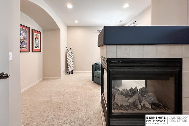 details featuring carpet floors, recessed lighting, baseboards, and a tile fireplace