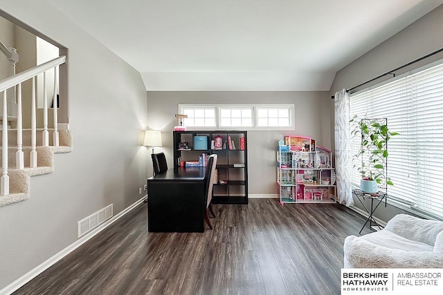 office featuring baseboards, visible vents, and wood finished floors
