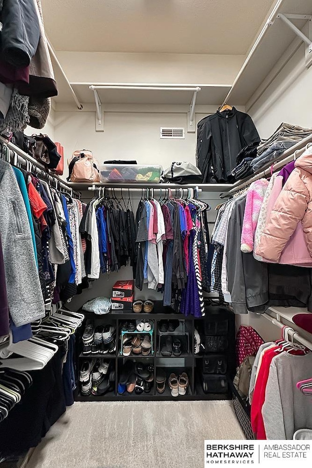 walk in closet with visible vents
