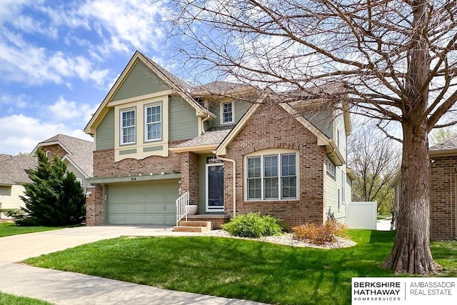 craftsman house featuring roof with shingles, brick siding, a garage, a front yard, and concrete driveway