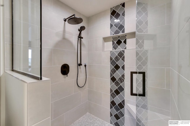 full bath featuring a tile shower