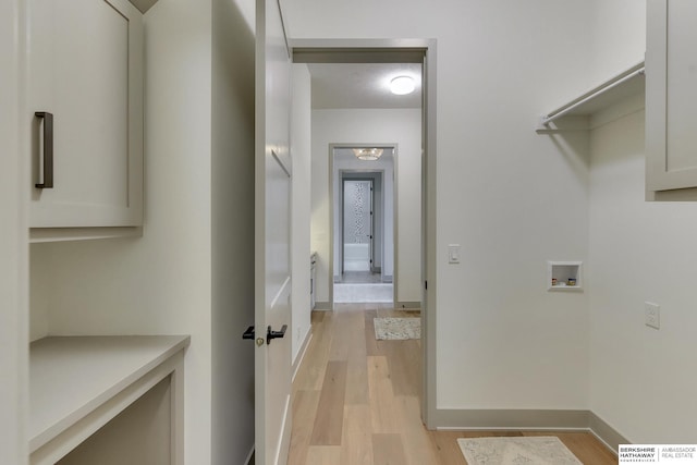 laundry room featuring washer hookup, laundry area, visible vents, baseboards, and light wood finished floors