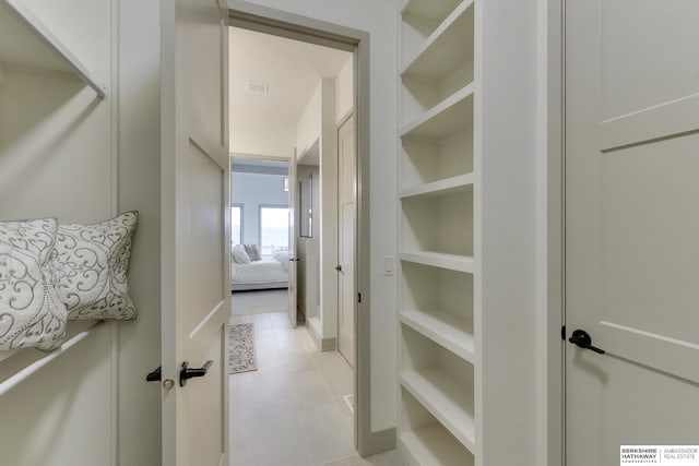 hallway with built in shelves