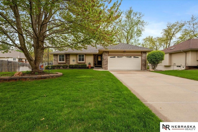 single story home featuring an attached garage, fence, driveway, and brick siding