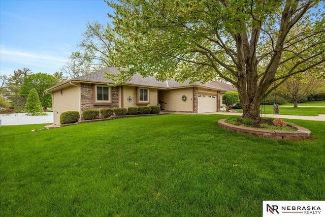ranch-style house featuring an attached garage, a front lawn, fence, and concrete driveway