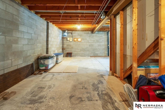 unfinished below grade area with concrete block wall