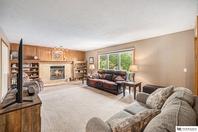 living room with a textured ceiling, carpet, and a fireplace