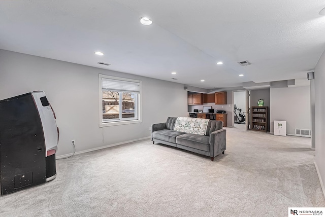 living area with wine cooler, visible vents, recessed lighting, and light colored carpet