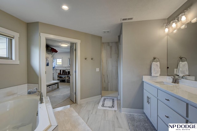 full bath featuring visible vents, vanity, a bath, and a shower stall