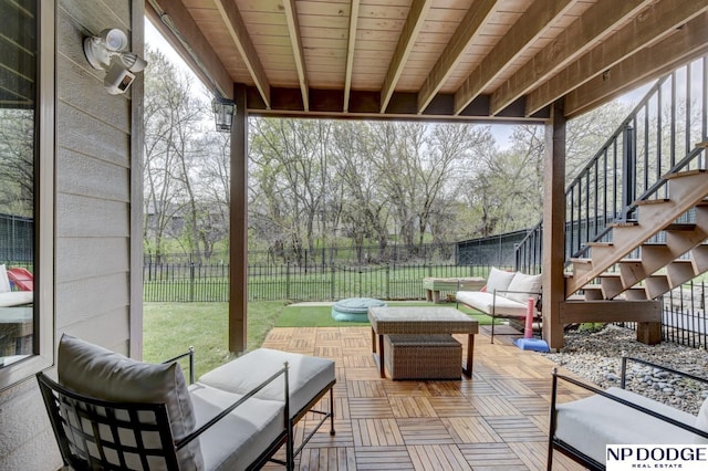 view of patio / terrace featuring an outdoor living space, a fenced backyard, and stairs